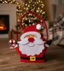 Bolsa de dulces navideña de fieltro rojo con diseño Santa Claus